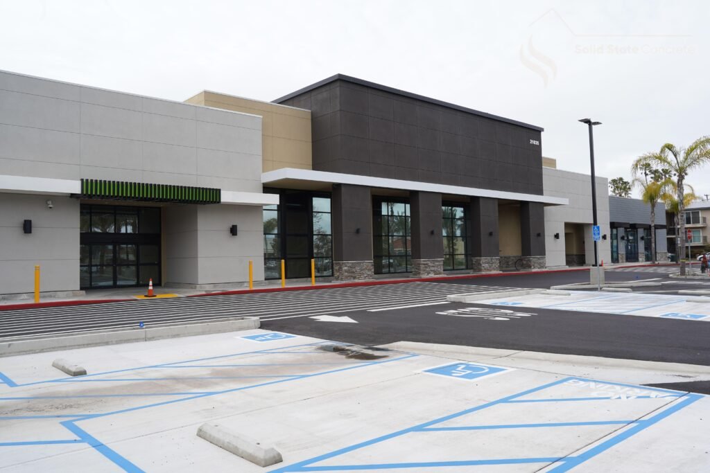 Retail storefront construction with ADA-compliant concrete parking and sidewalks in Fargo.